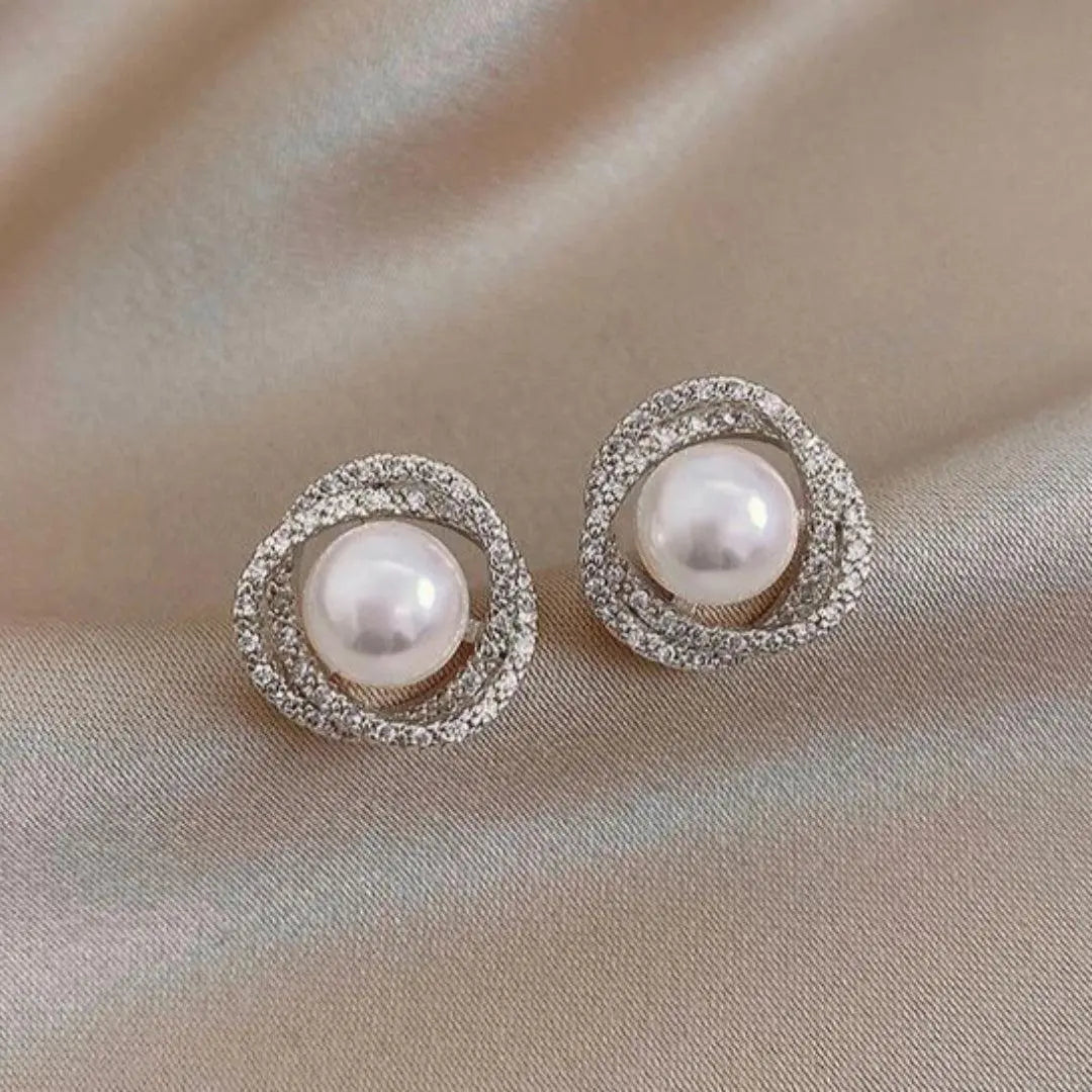 Shiny spiral earrings with elegant pearls Unique Joyas