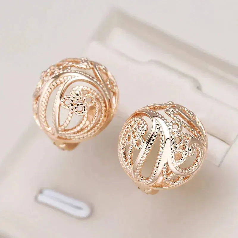 Elegant Hollow Ball Earrings in Gold Unique Joyas