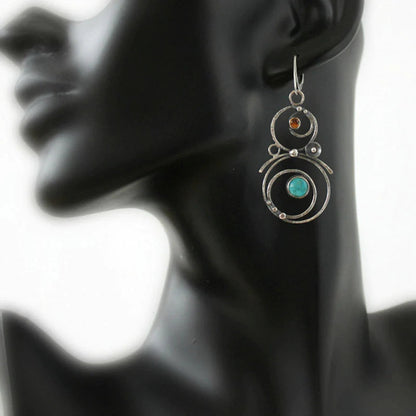 Earrings with blue and orange stones