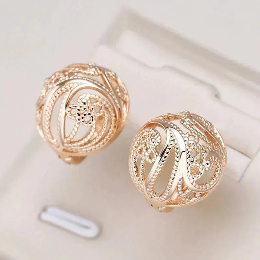 Elegant Hollow Ball Earrings in Gold Unique Joyas