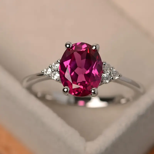 Noble silver ring with oval pink stone