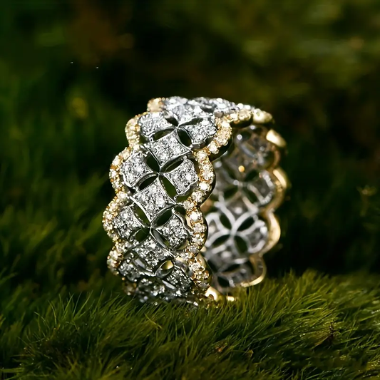 Hollow ring made of gold and silver with sparkling elements