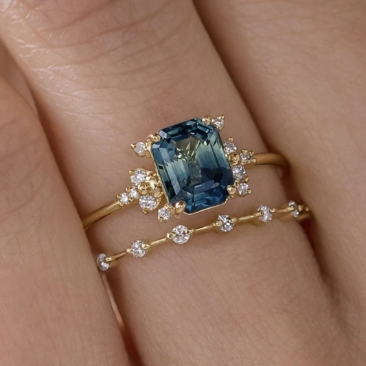 Ring set with blue stone and small crystals